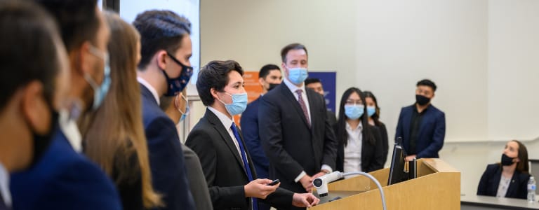 Student in front of podium presenting