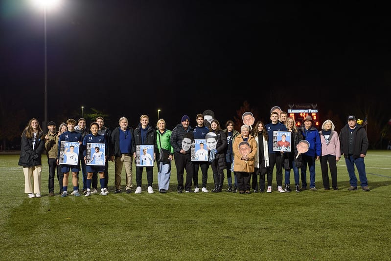 A group of people holding posters

Description automatically generated