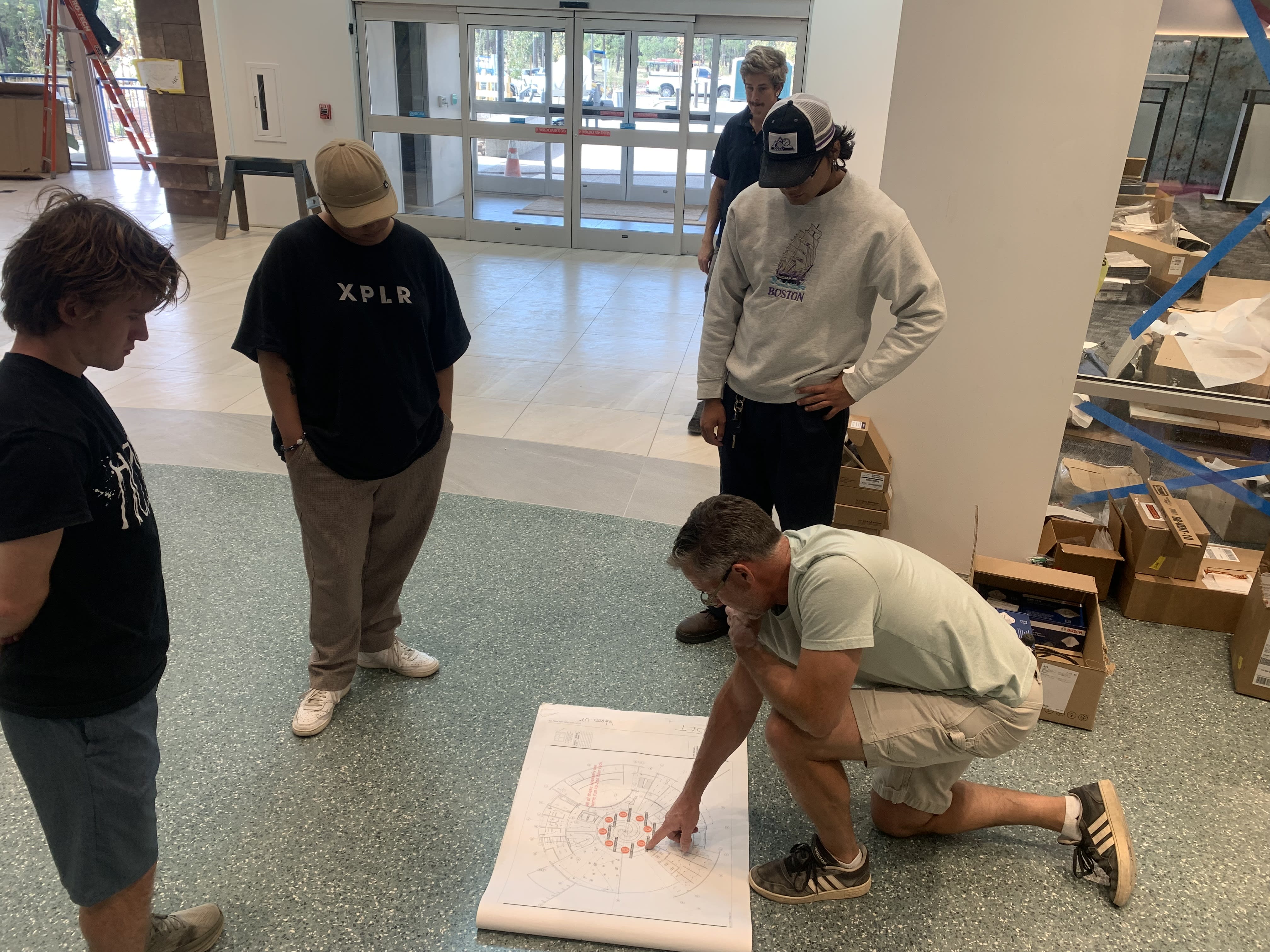 Members looking at a schematic