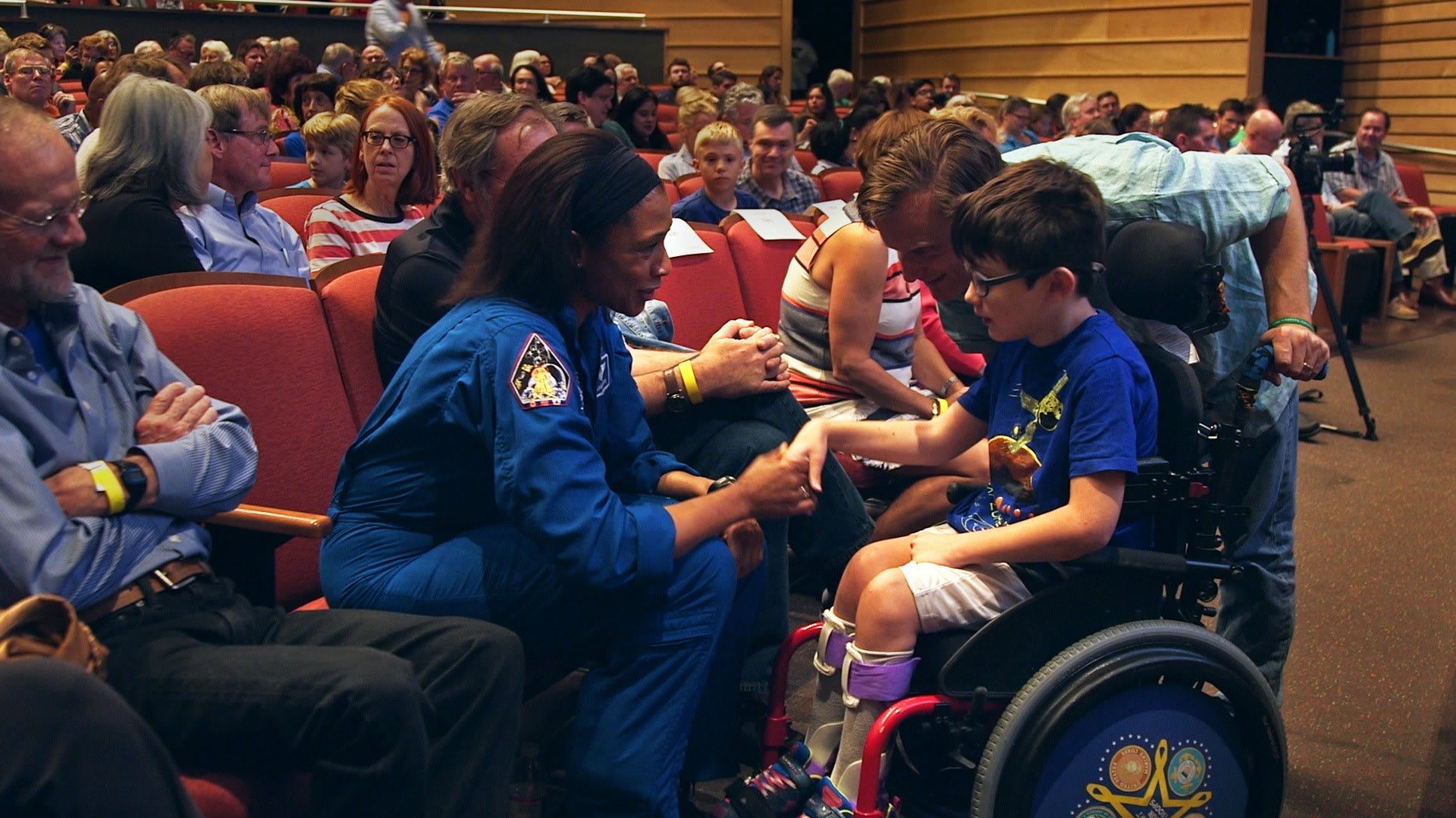 Dr. Jeannette Epps talks with student at Hot Science - Cool Talks event.