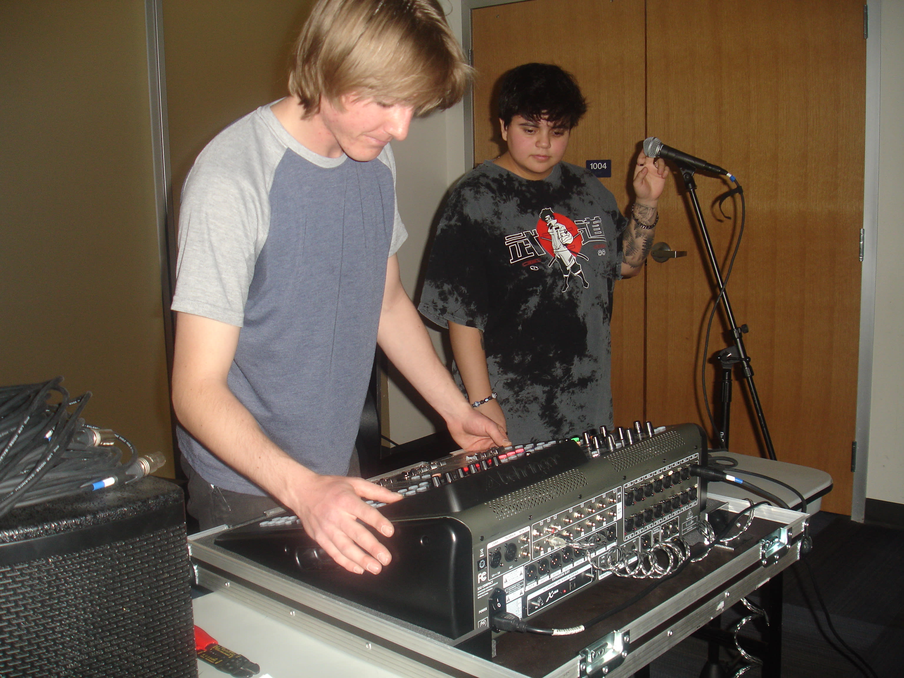 Club member at a mixing board