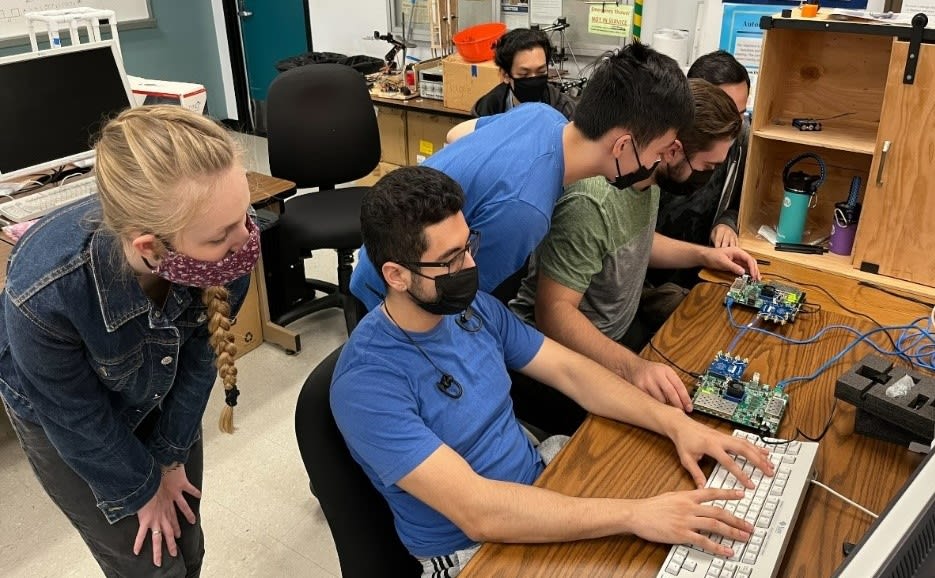 students programming on computers