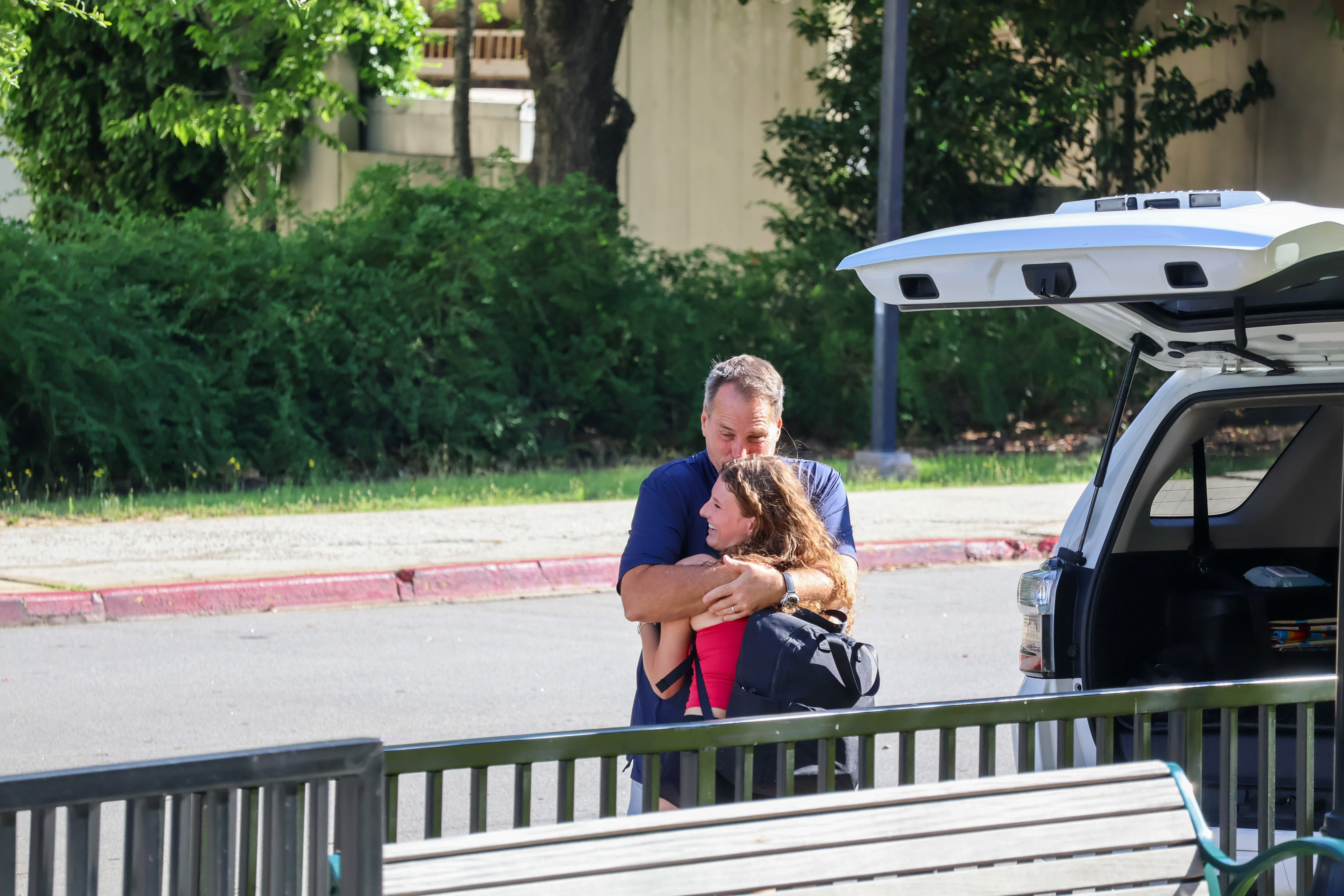 Photo of parent hugging child