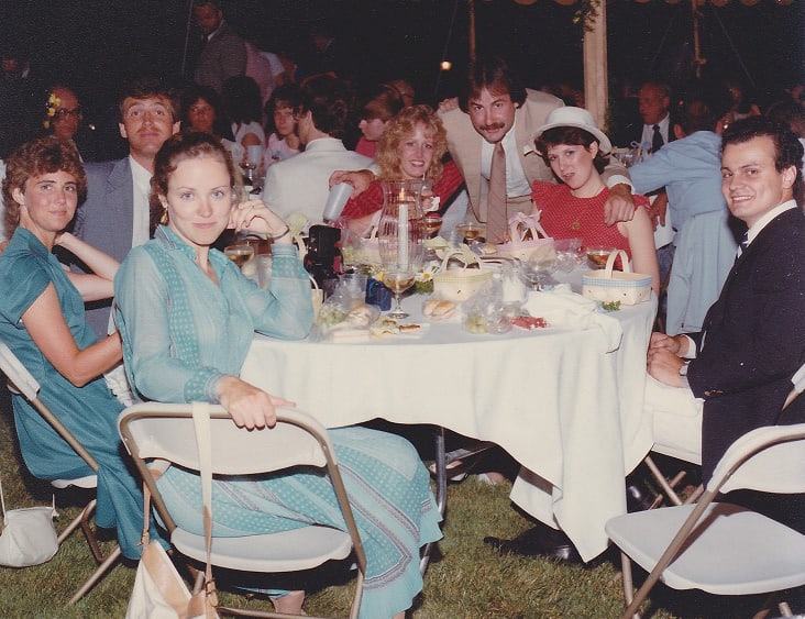 Group of people sitting at a table during a wedding reception