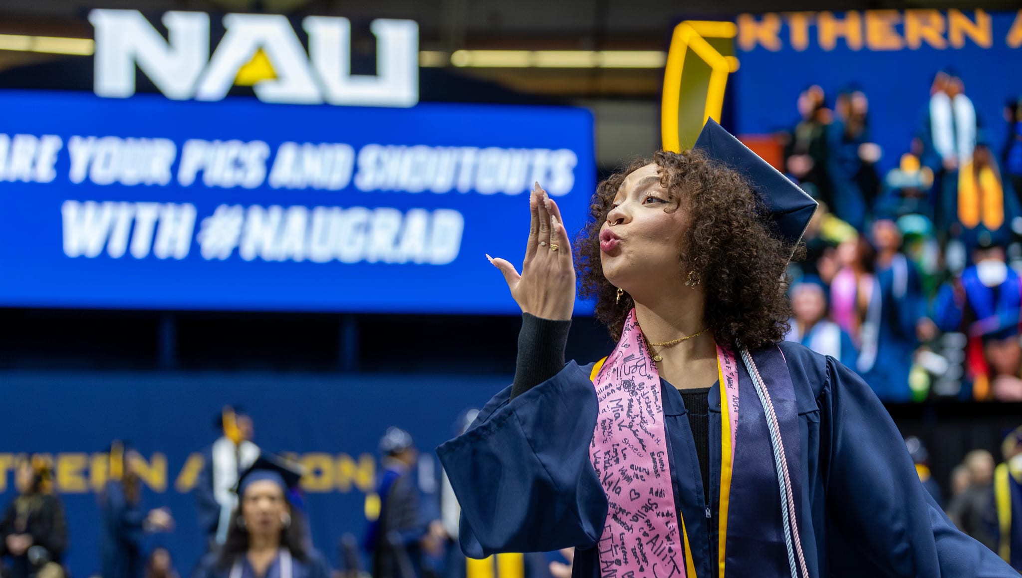 Graduate Blowing a Kiss