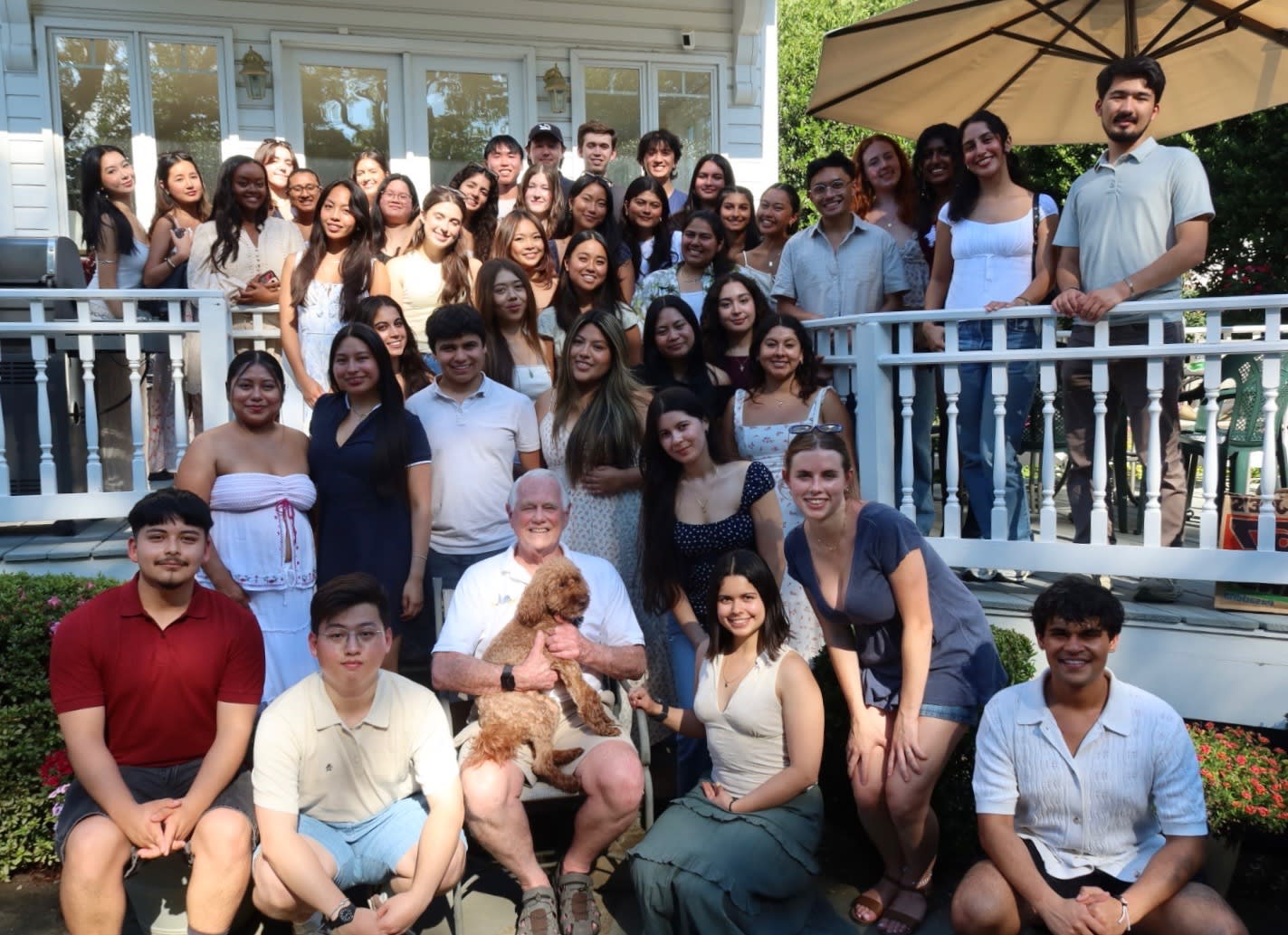 Summer 2026 CITC Cohort smiling together on an outdoor porch in the summer in DC.