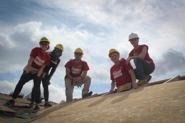 Posing on the rooftop for a photo on last year's trip.