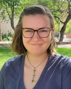 A person wearing glasses and a necklace
AI-generated content may be incorrect.