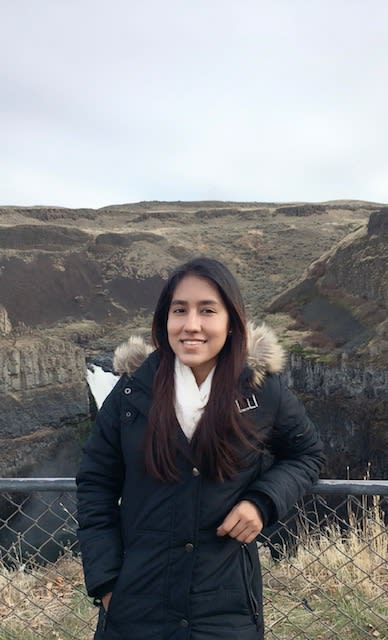 student Sandi Thu, standing at Palouse Falls