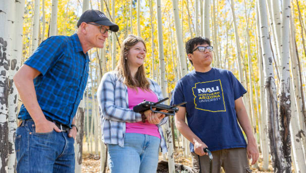 Forestry students in aspen grove with professor