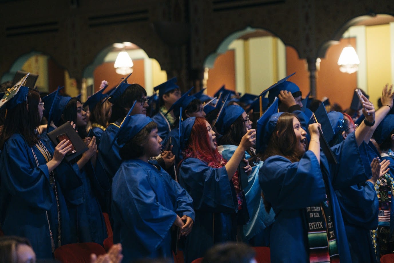 A group of people in graduation gowns

Description automatically generated