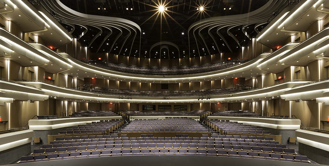 An expansive view of the Moss Arts Center's Anne and Ellen Fife Theatre as seen from center stage looking towards the empty seats in the house.