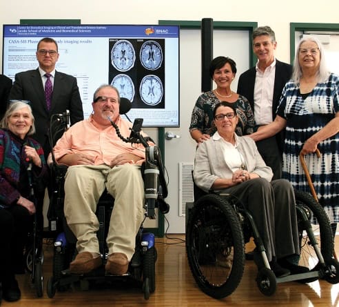 A group of people posing for a photo

Description automatically generated