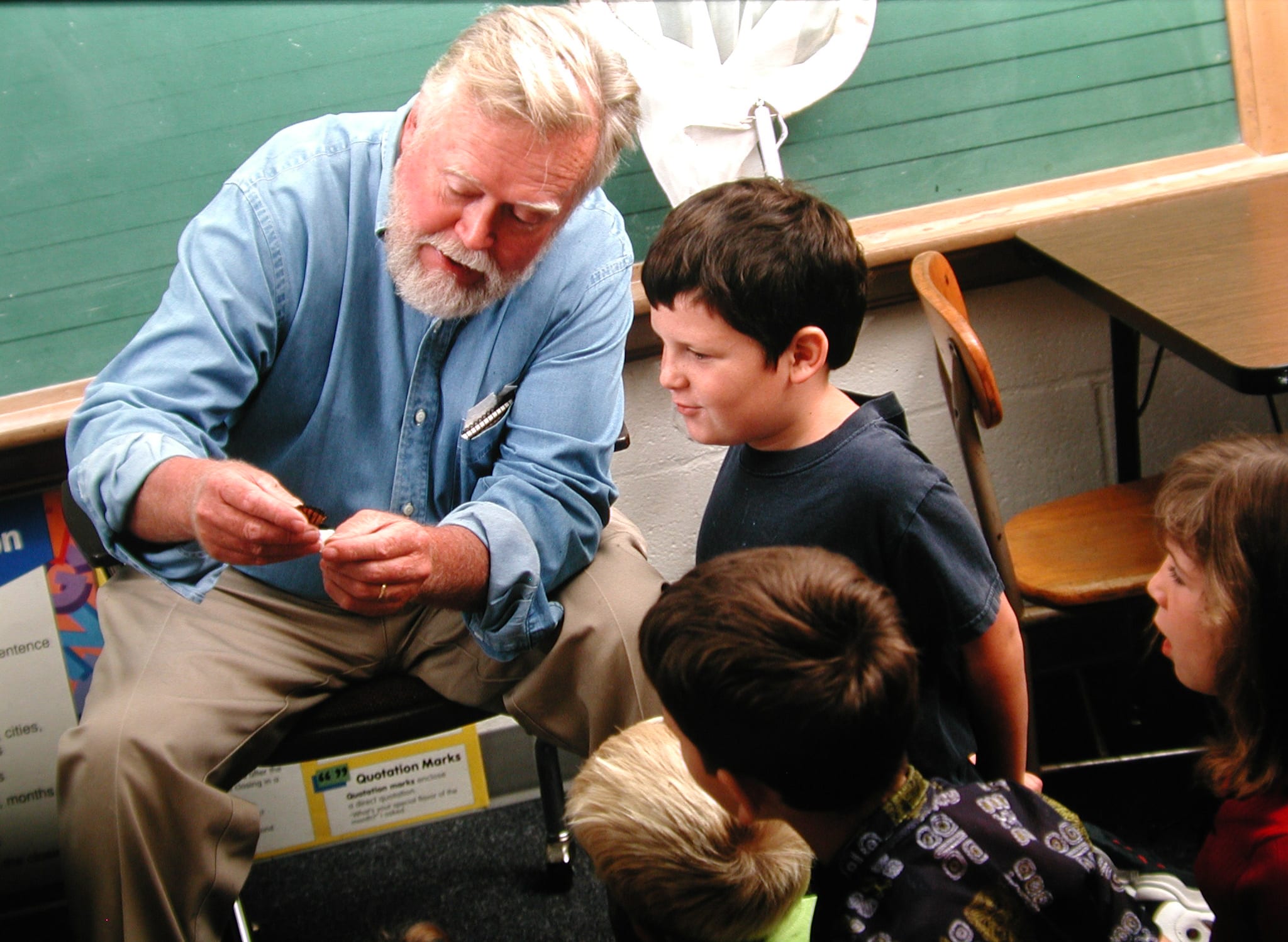 Chip and children in a classroom