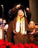 USAO Research Program graduate Brittani Mulkey receiving her graduation hood