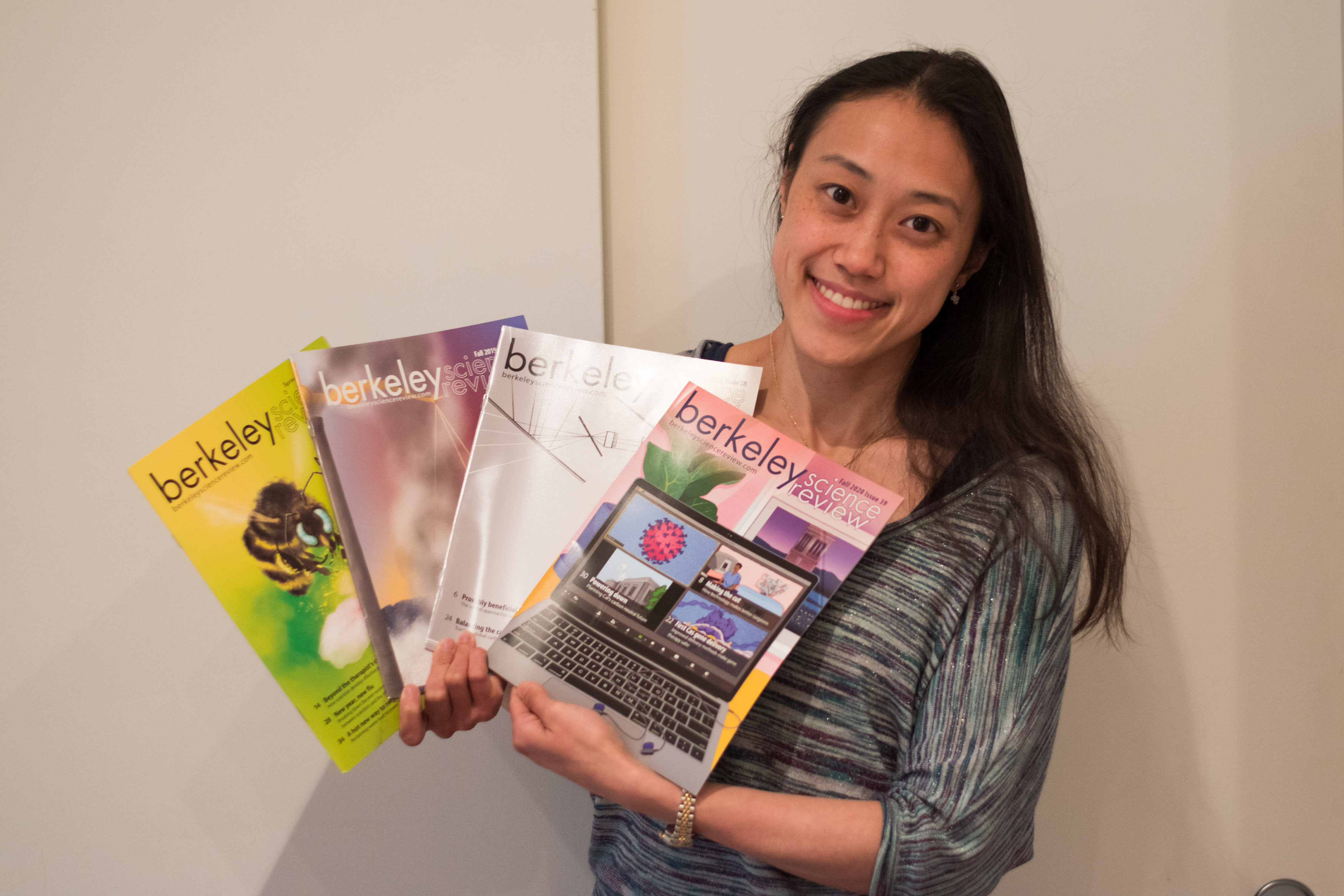 Blog editor in chief Maiko holding up BSR magazines