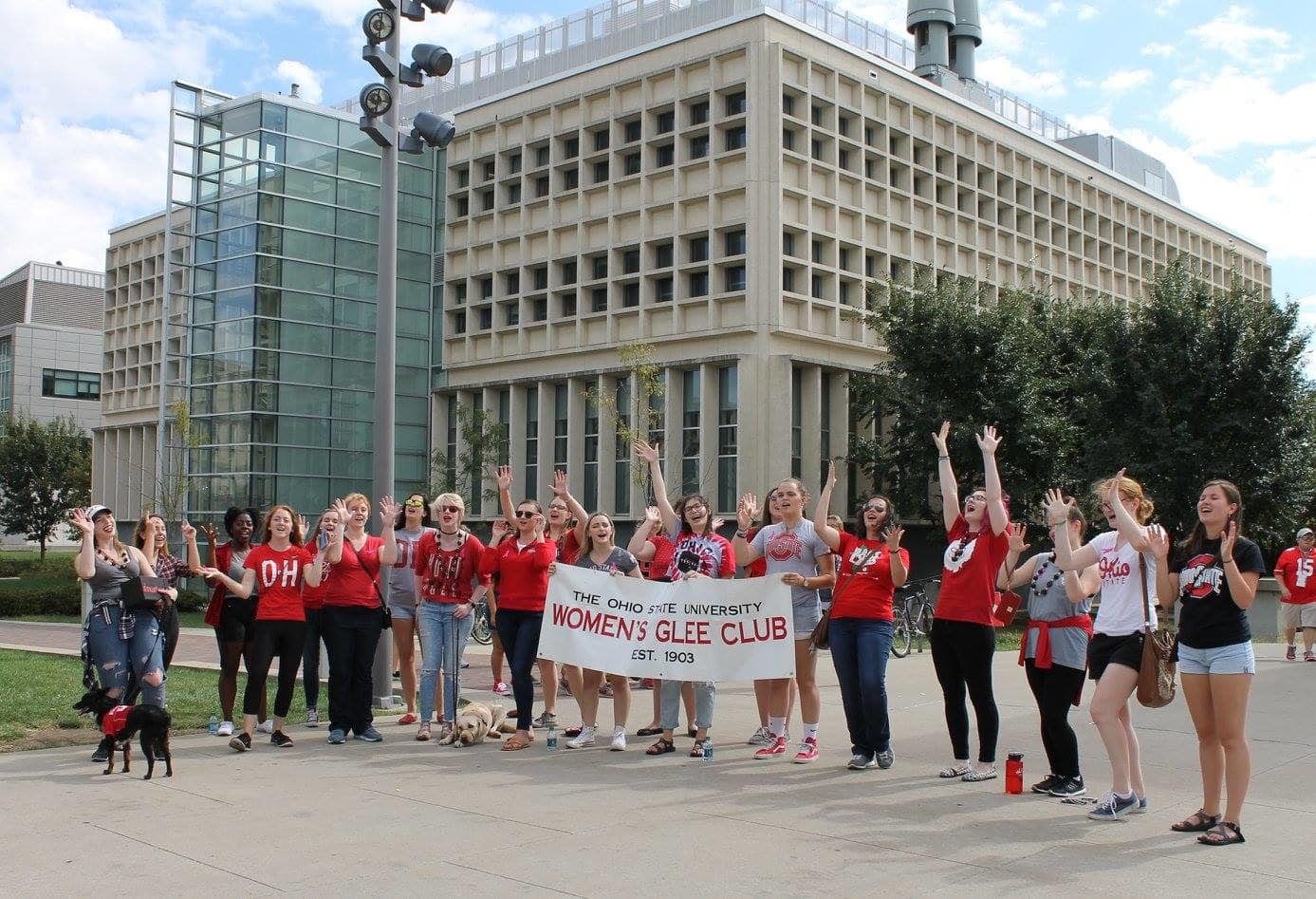 Members of the Women's Glee Club cheering on the Buckeyes to football victories