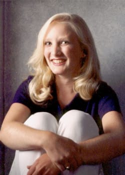woman with arm around crossed legs