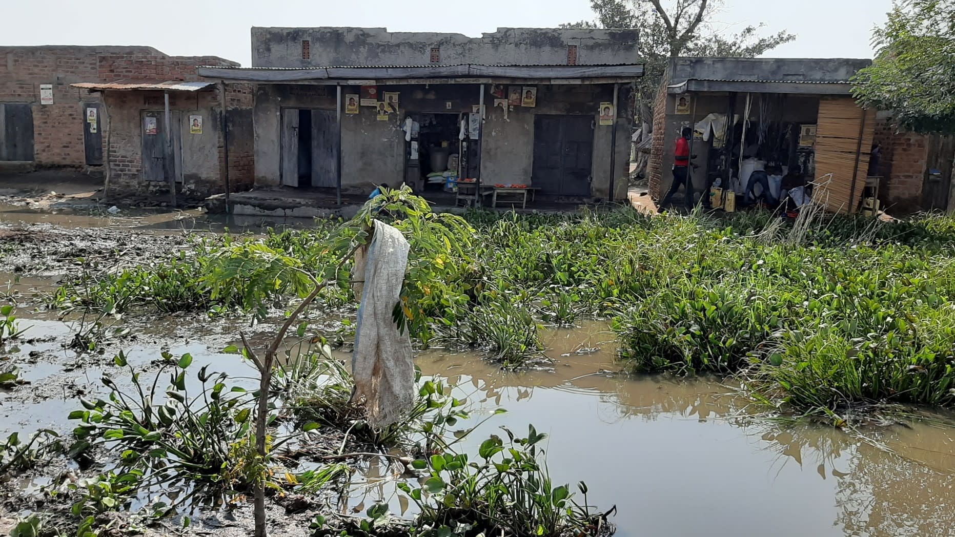 Weeks after flooding, the water is barely receding. 