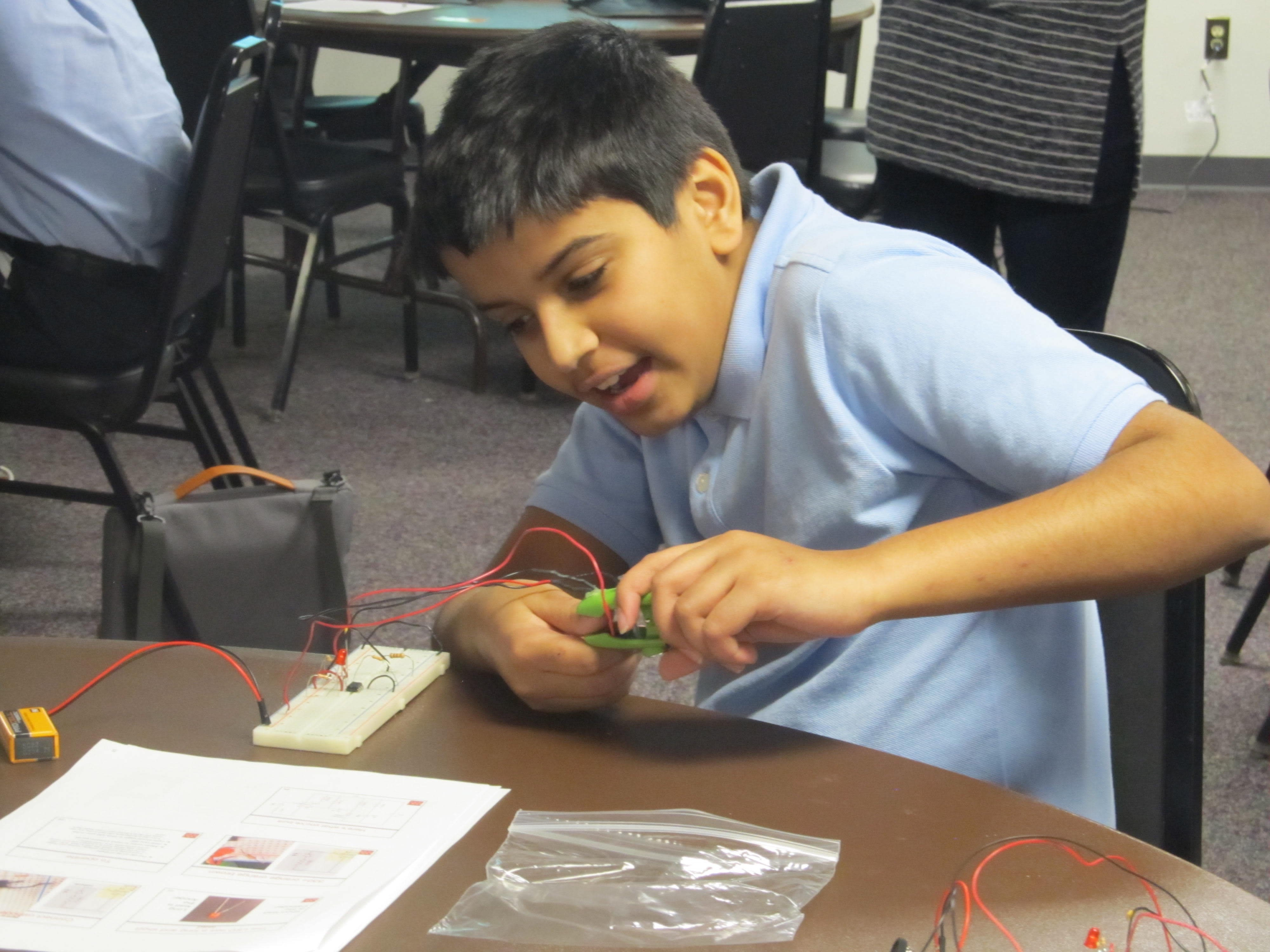 A student from St. Andrews school testing our a heart rate monitor he built!