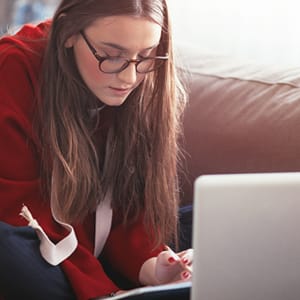 Student is studying in front of her laptop