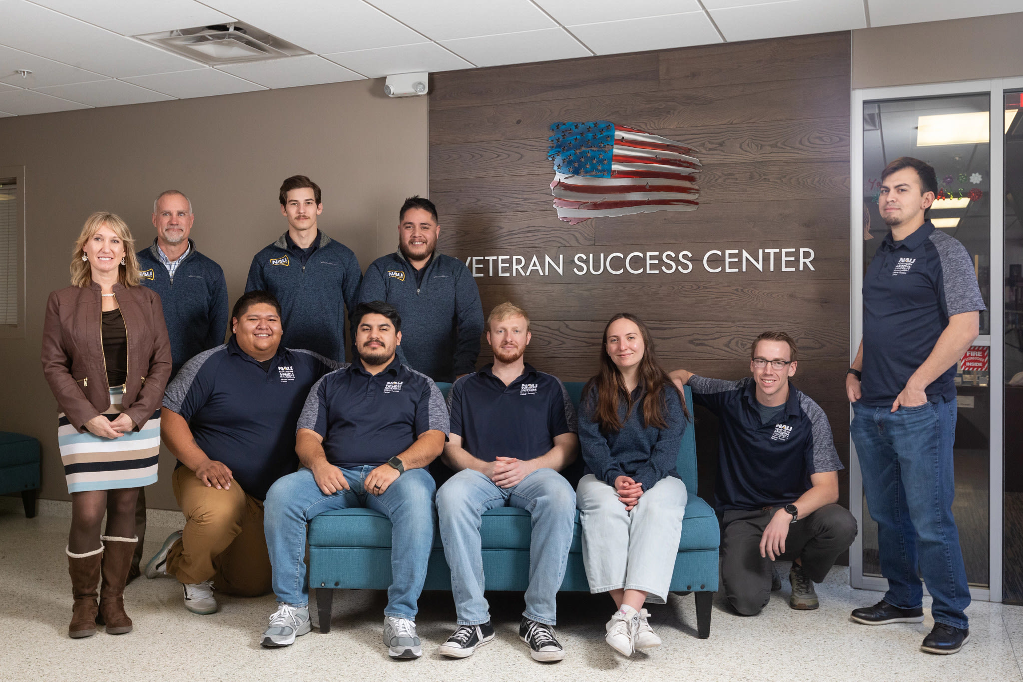 A group of people posing for a photo

Description automatically generated