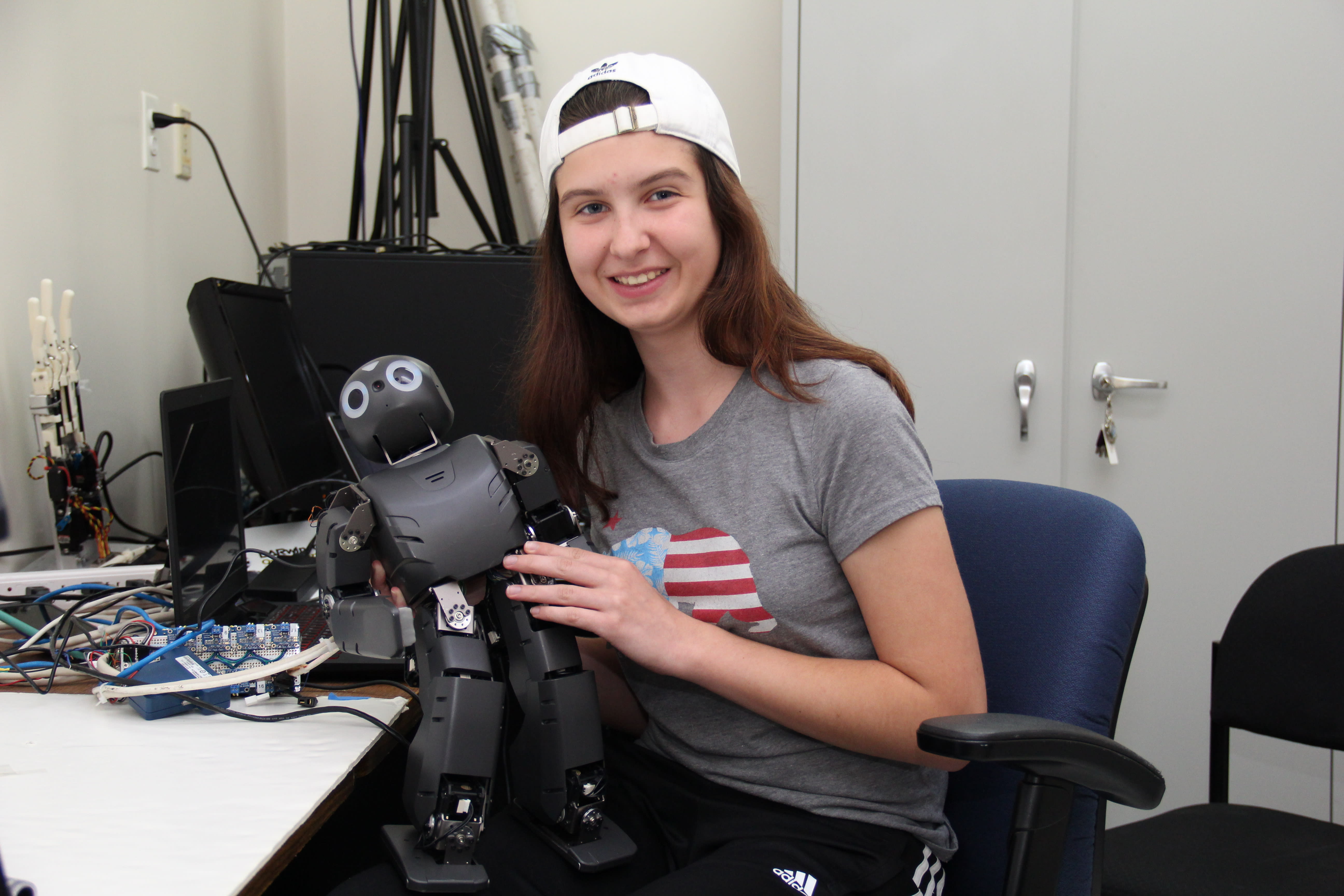 girl holding a robot