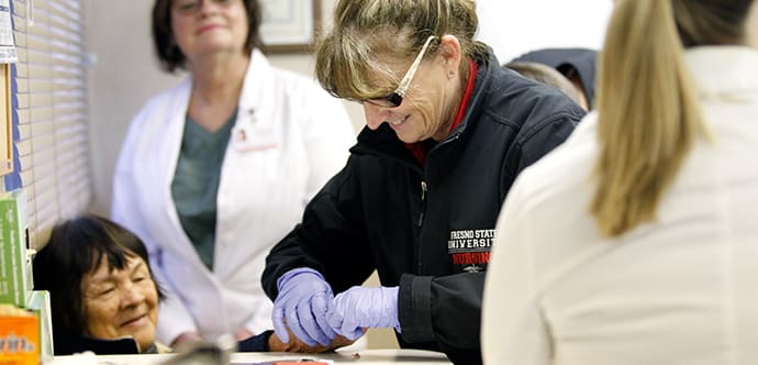 Fresno State students provide free health services to rural communities through the Community Health Mobile Unit.