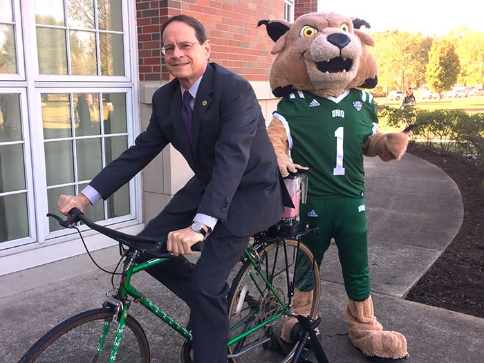 photo of David on a bike with Rufus