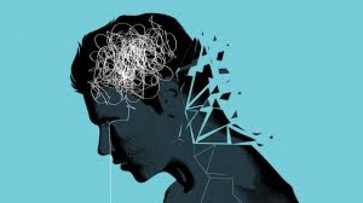 A drawing of a man, whose body is cracking, brain is jumbled, and tears stream from his eyes 