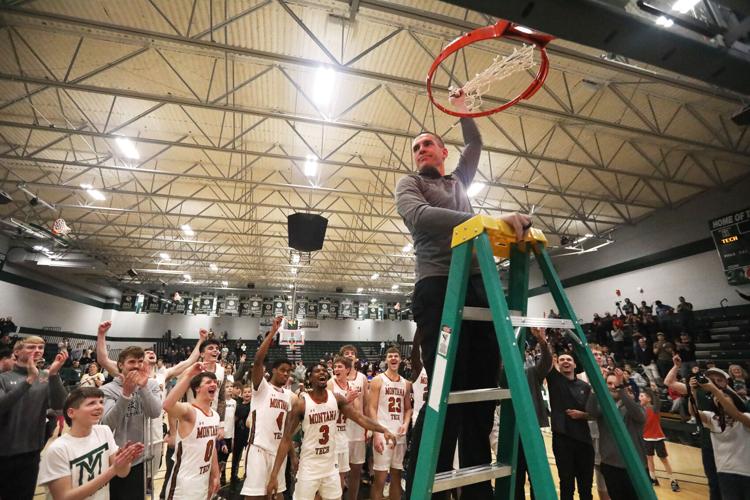 Coach Hiatt cutting down the net