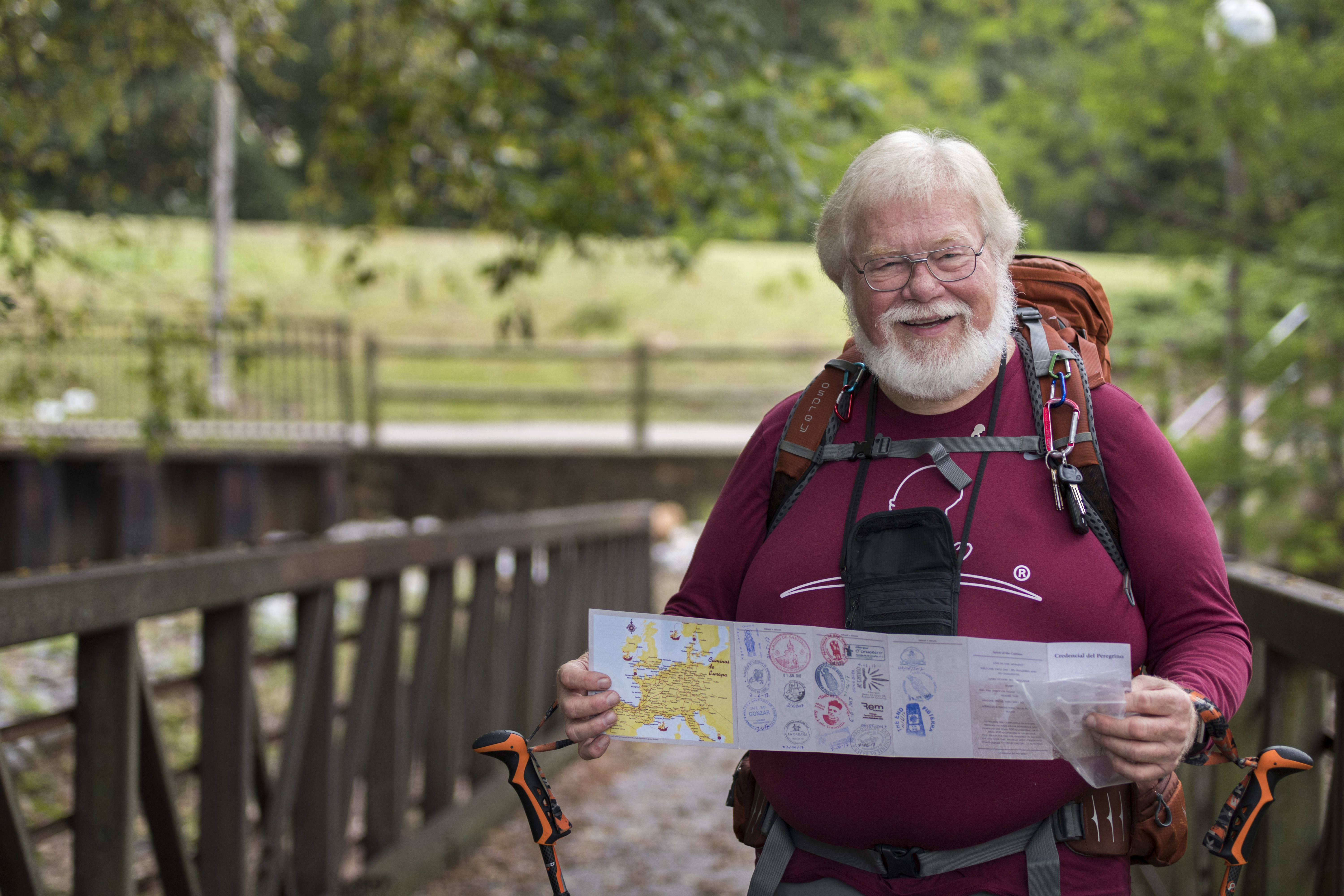 Mike Burger hiking in a park