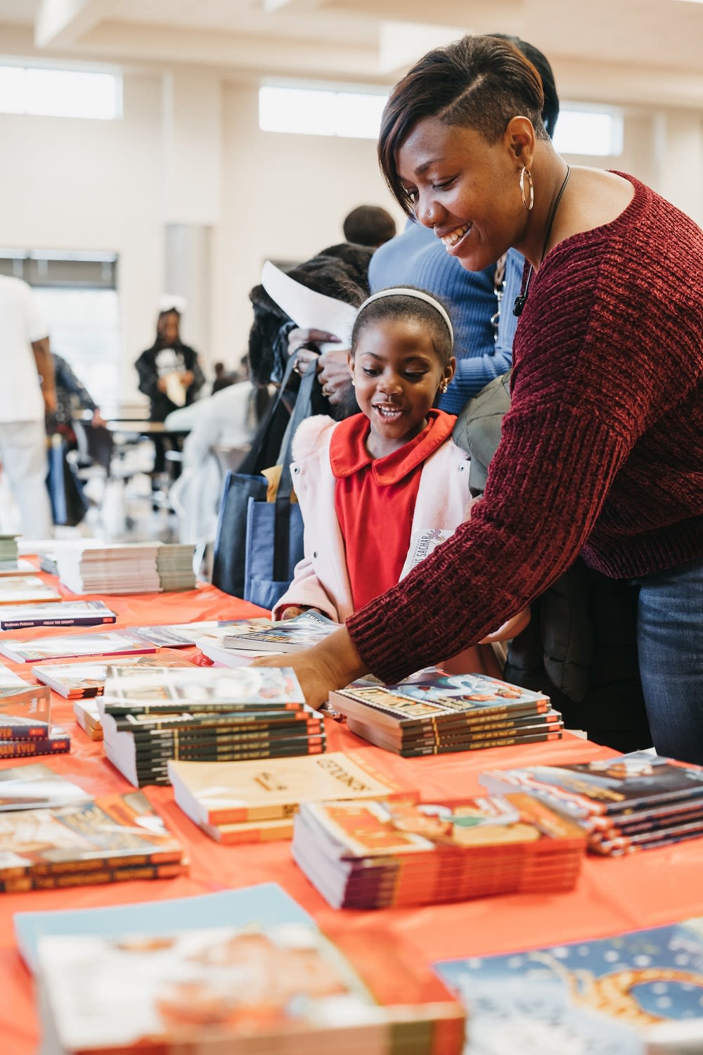 College students help kids find books to read.