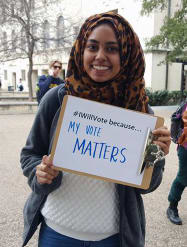 Girl holding "My Vote Matters" Sign