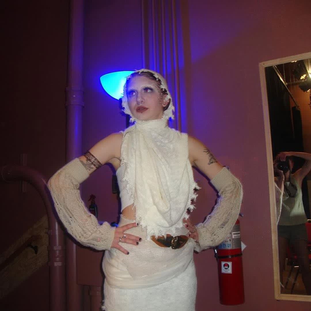NAMA member posing in a white outift