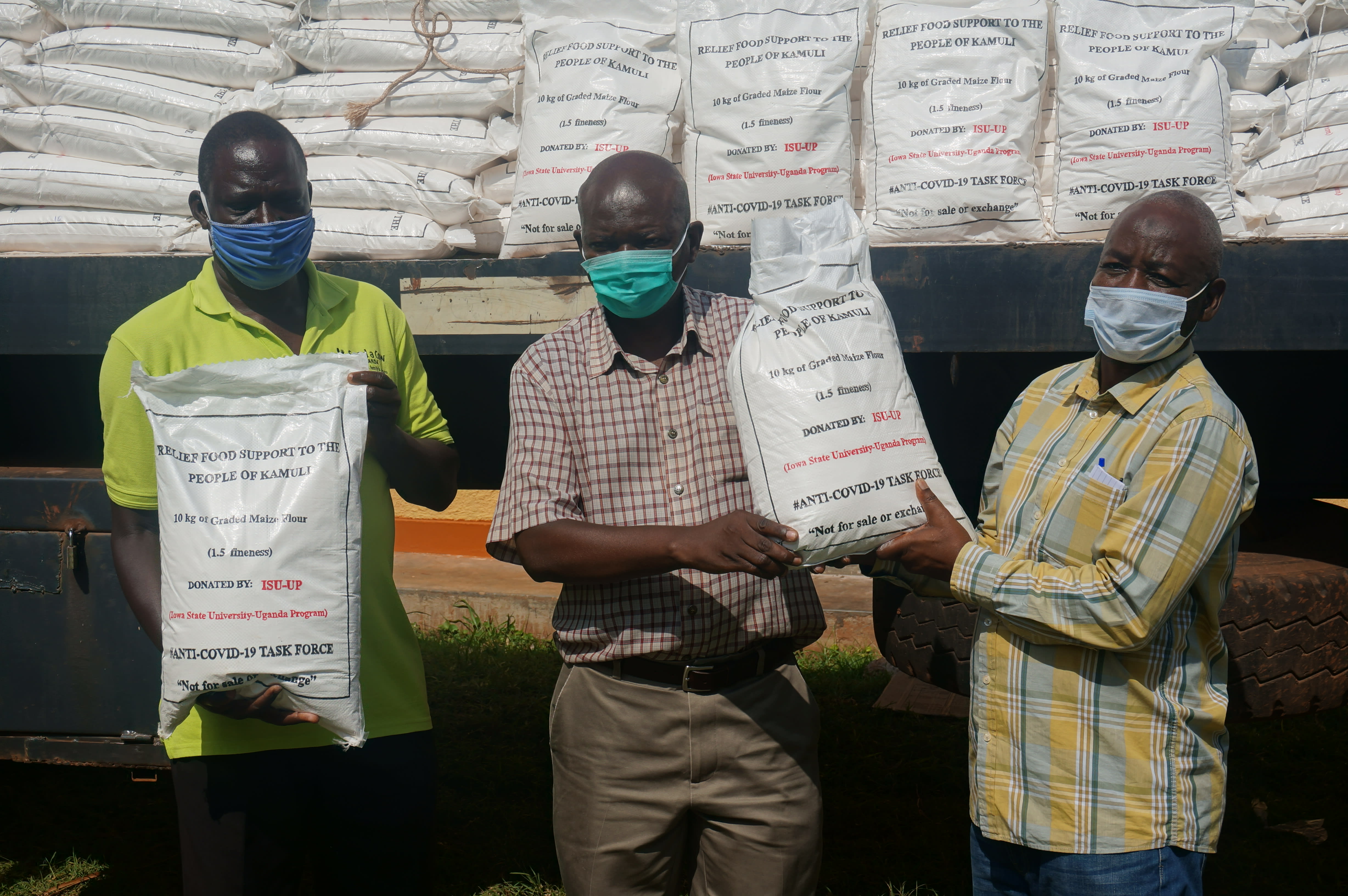 ISU-UP staff collaborate with district officials to provide emergency relief food aid. 