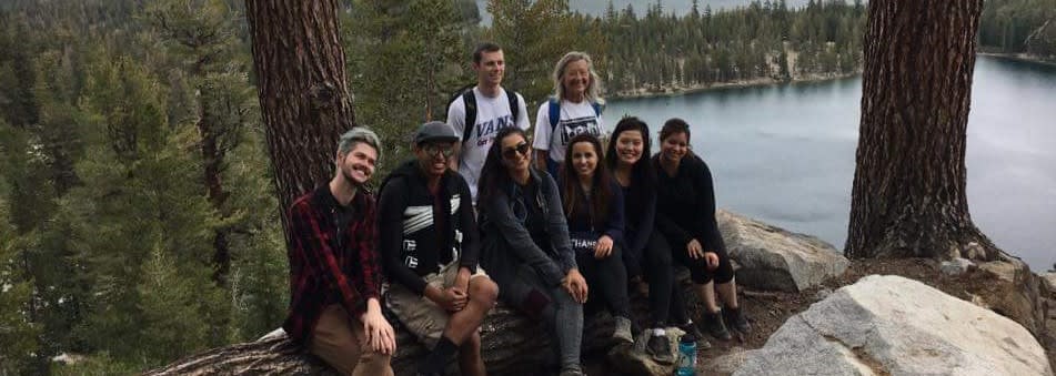 Maria in the field with a group of students