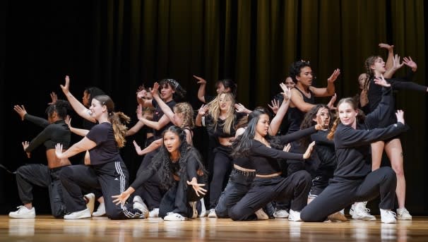 Unity Dance Crew on stage during a performance.