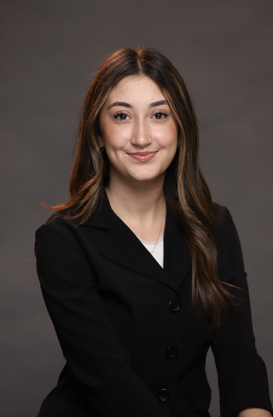 Jennifer, senior, scholar sitting at her desk working at her computer
