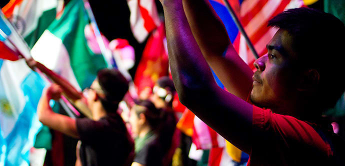 Students waving flags of the world