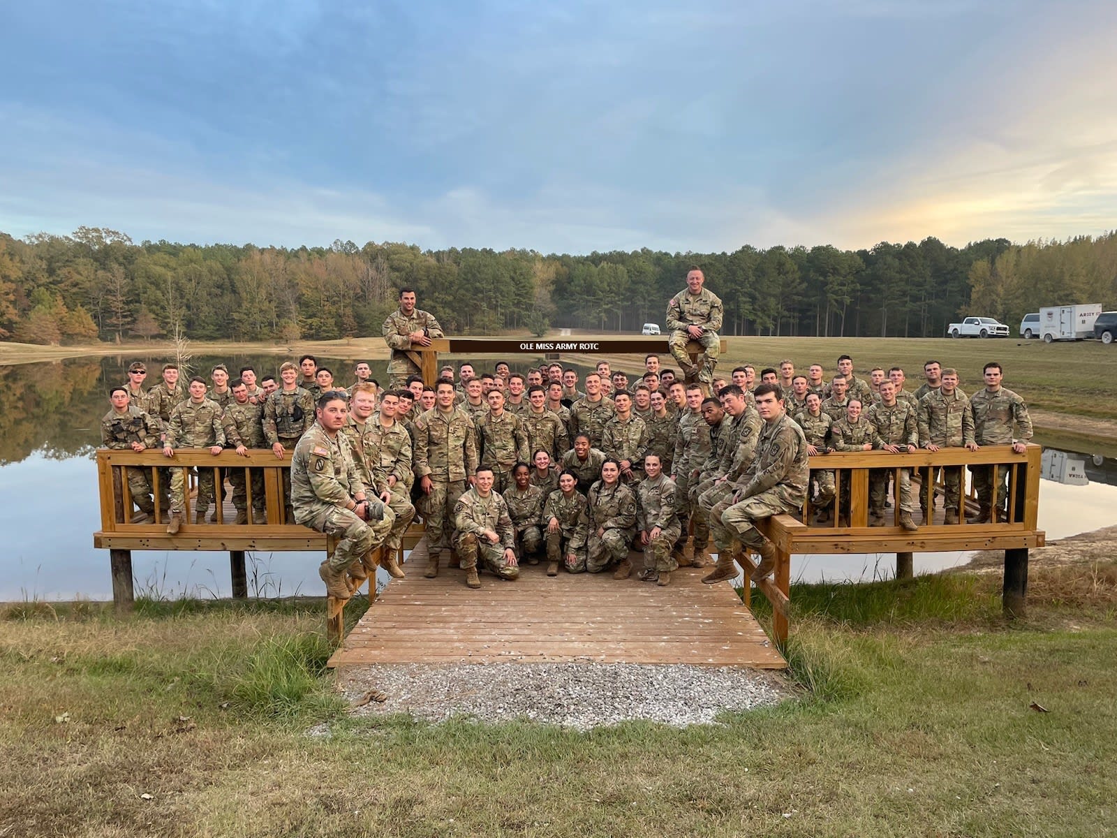 Army cadets gather together at a lake