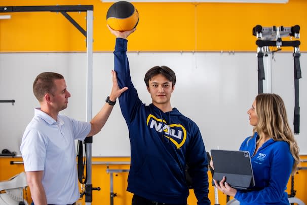 Physical Therapy students working with a patient
