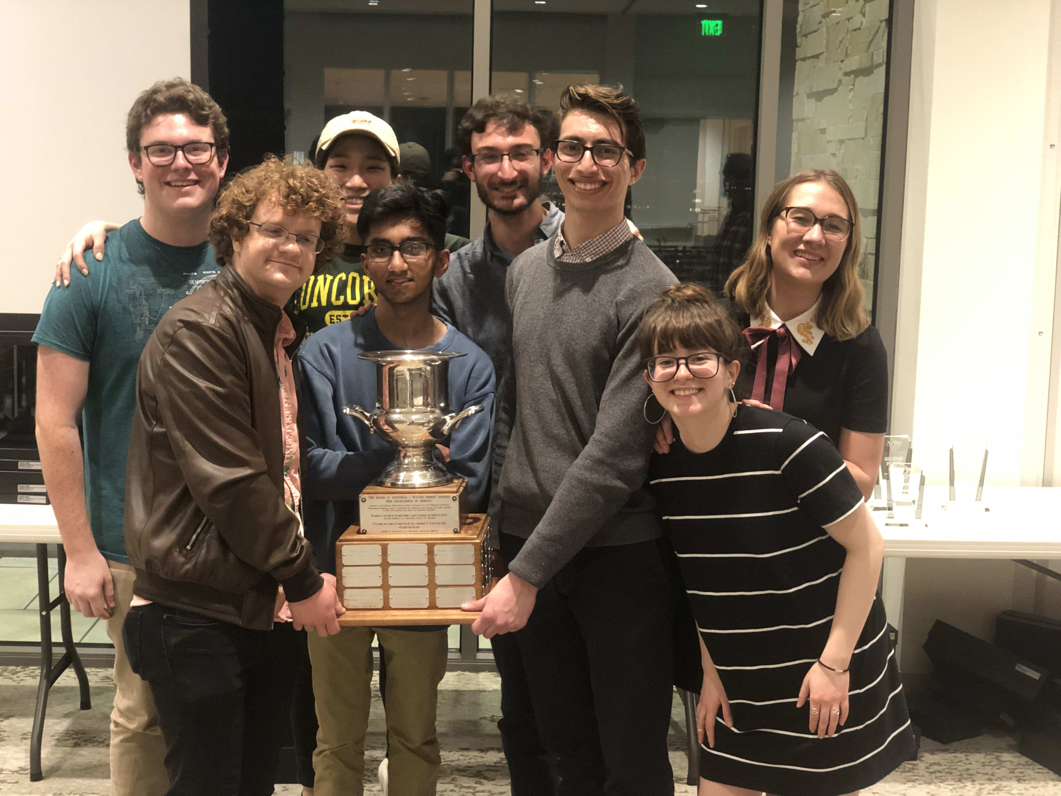 Photo of the team with the NPDA trophy after closing out NPDA nationals. 