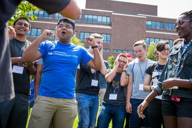 Students cheering each other on during an Honors College gathering.