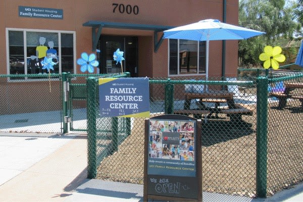 Family Resource Center patio fenced area with shaded seating.