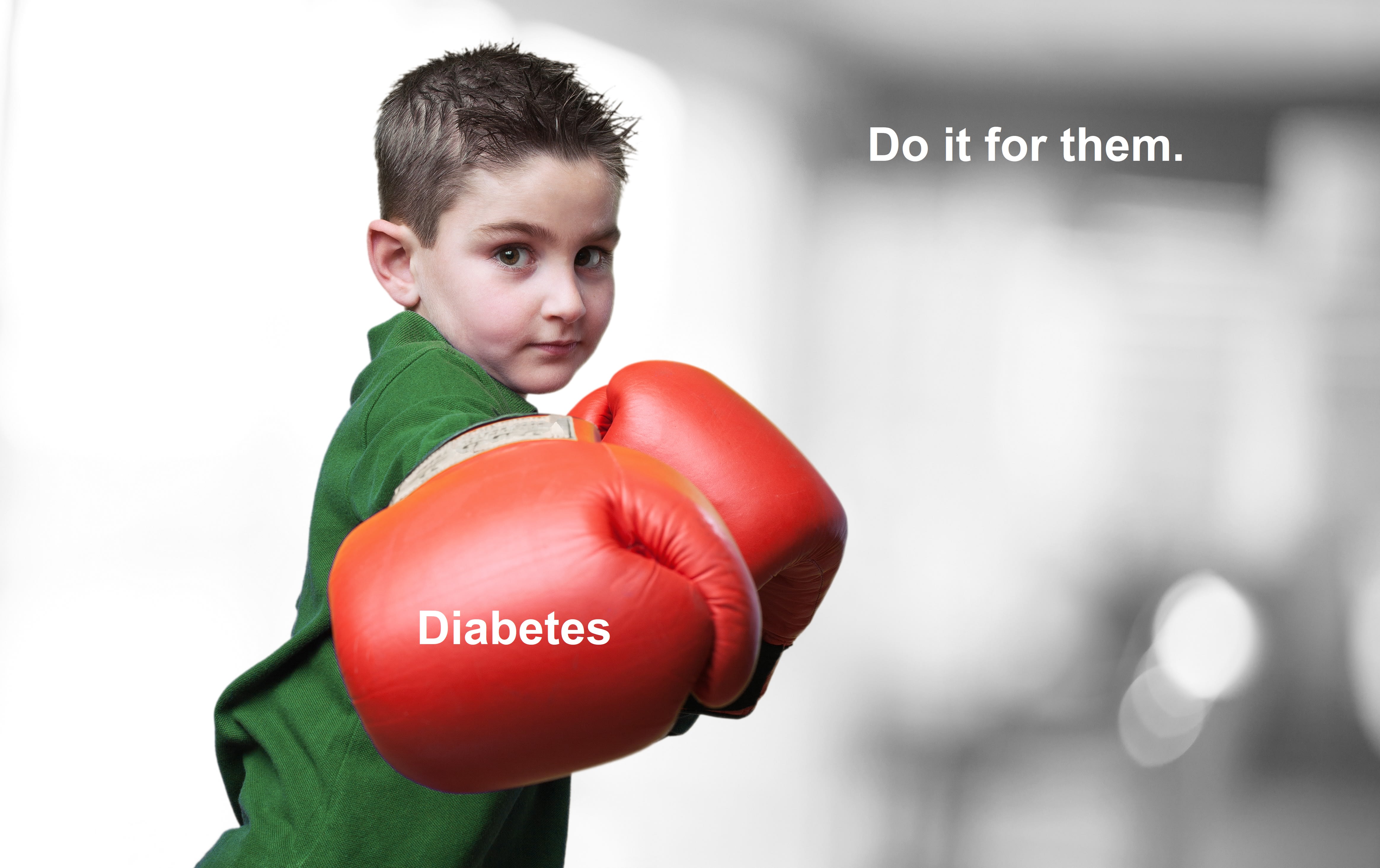 A child with red boxing glove punch towards the camera. One glove has 'diabetes' written on it; 'do it for them' is in the background