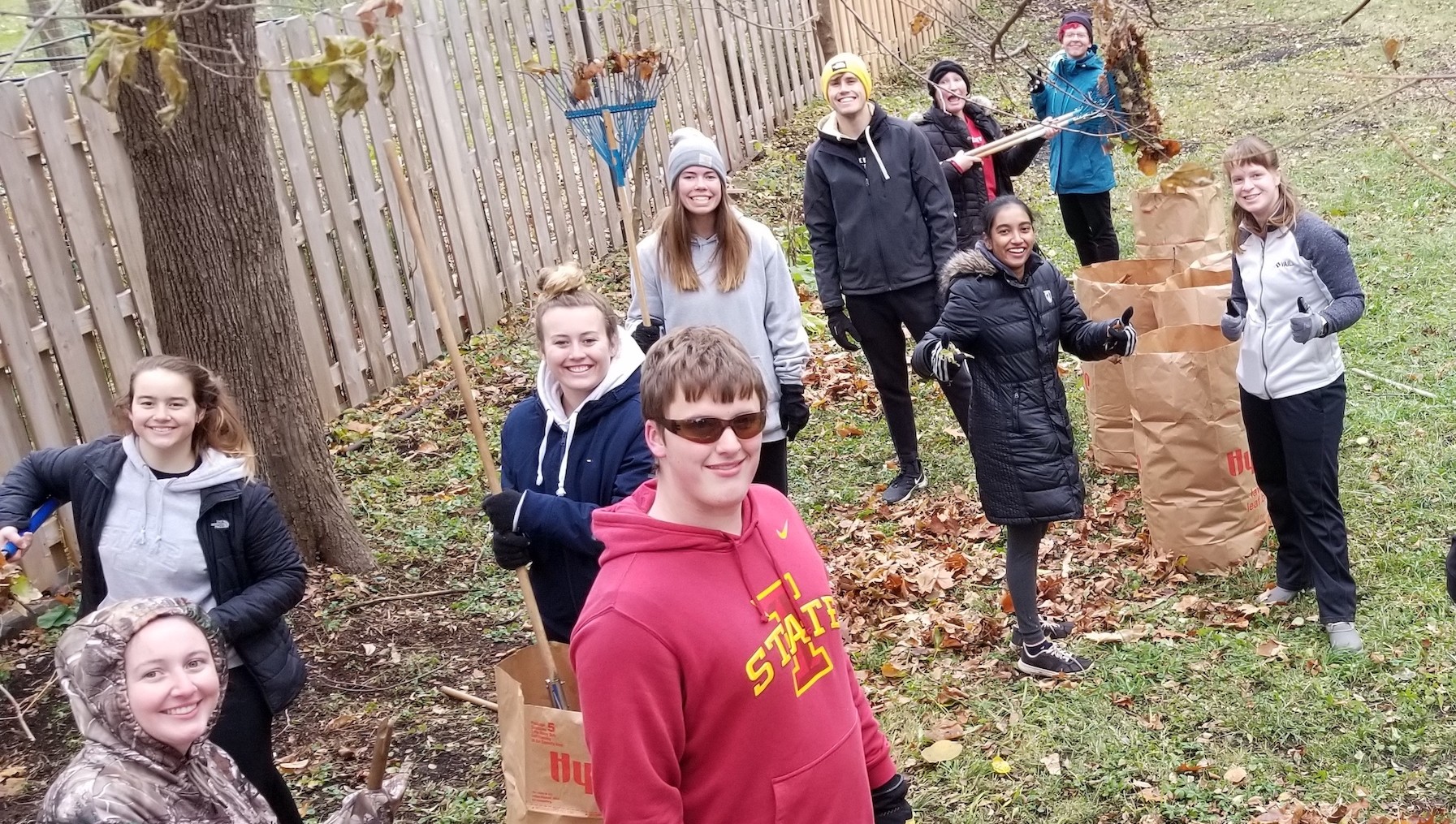 The Stupka Planning Committee has fun fundraising through leaf-raking