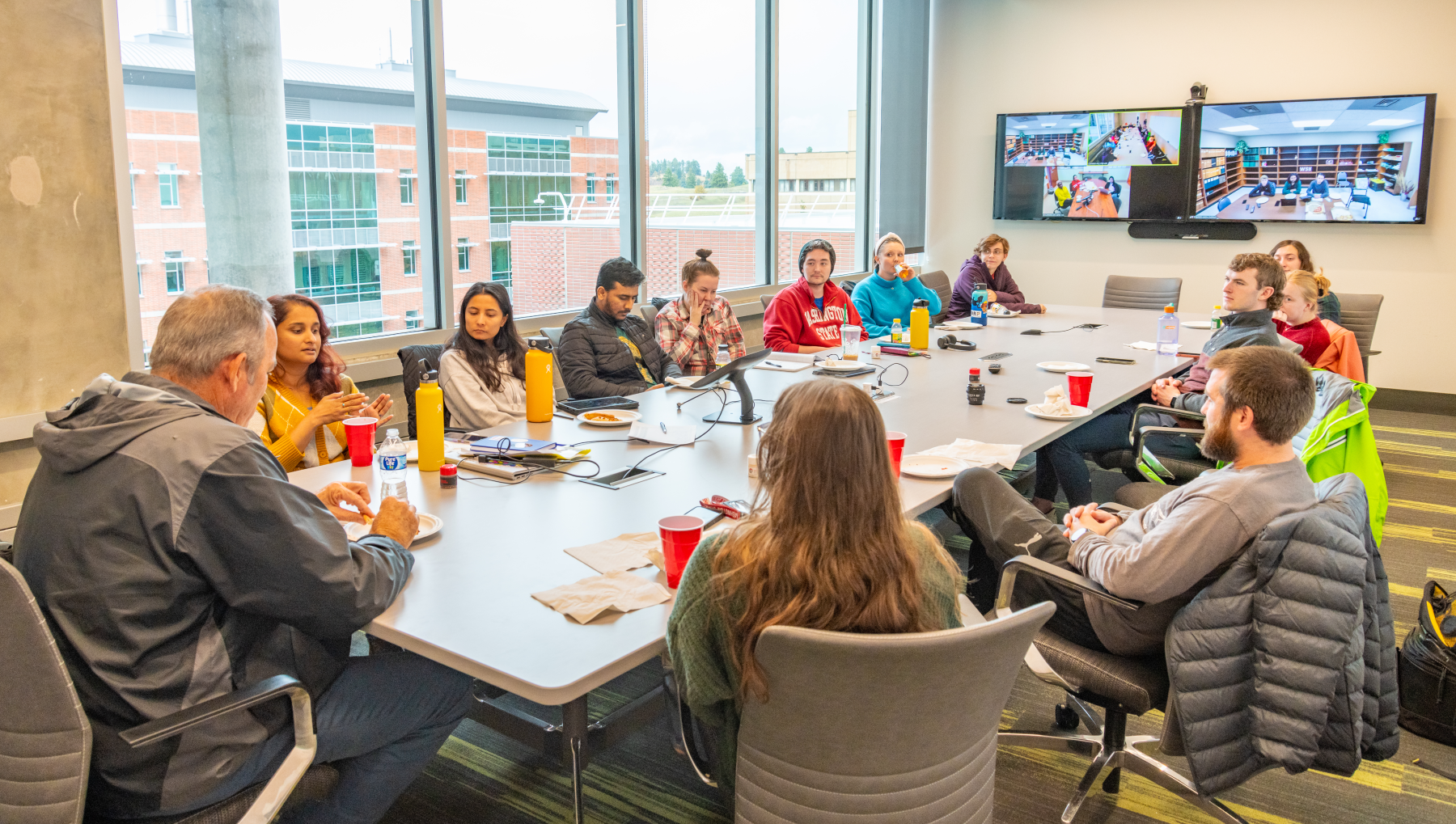 Students at lunch with Dr. Gerald Holmes (Fall 2023)