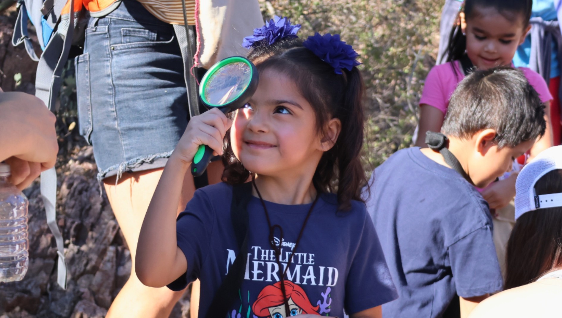Pre-K Student Learning How to Use a Magnifying Glass