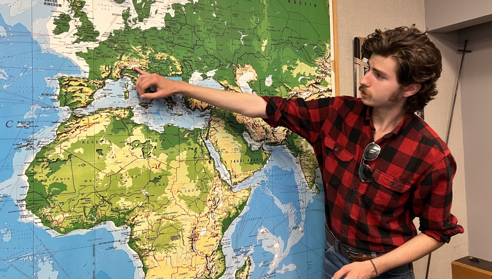 man pointing to a map